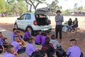 Asian teacher is teaching the music note for student group.